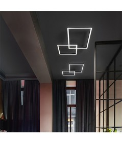 lampada a sospensione e a parete cross di perenz in alluminio nero ambientata